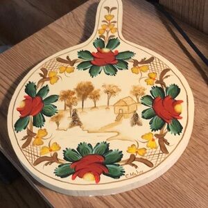Beautiful cutting board with picture of flowers and a cottage signed by C. Hahn